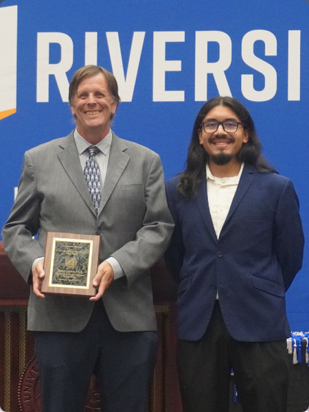 Dr. David Cocker being presented with Faculty of the Year Award