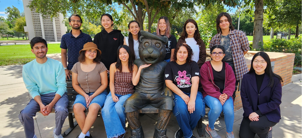 University Honors Ambassadors posing at Scotty the Bear bench